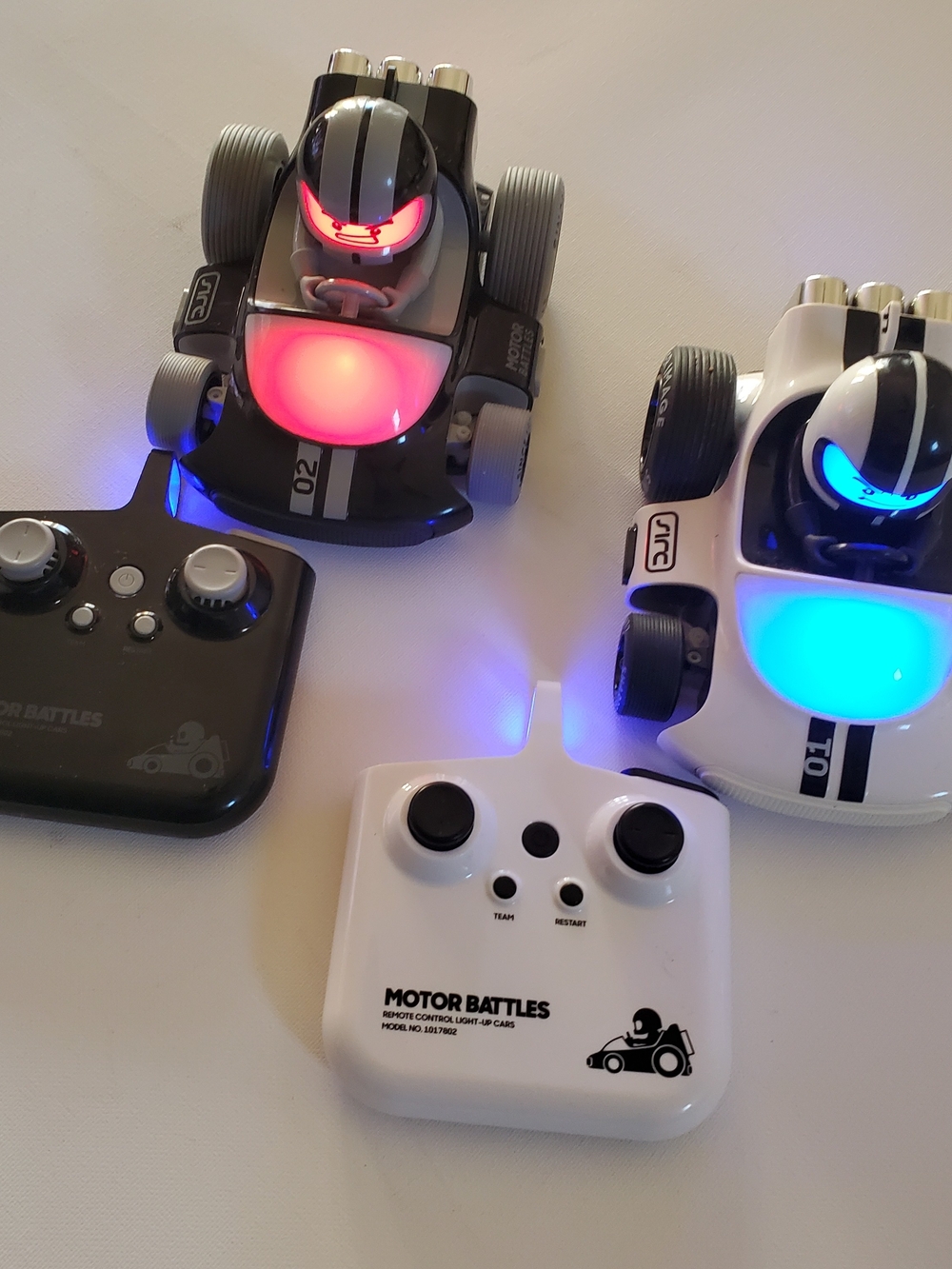 Sharper Image Glow RC Battle Cars — Black & White with Red & Blue LEDs